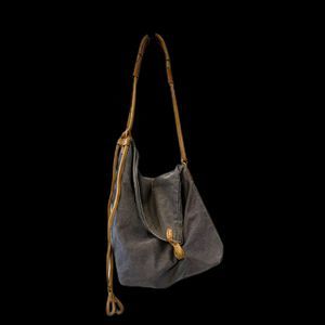Canvas and leather asymmetrical and adjustable bag
